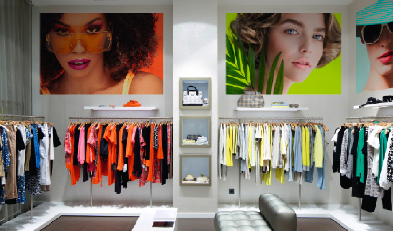 Colorful signs of models in a retail store.