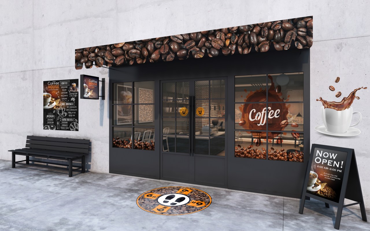 Exterior of coffee shop with window, wall and walkway graphics.